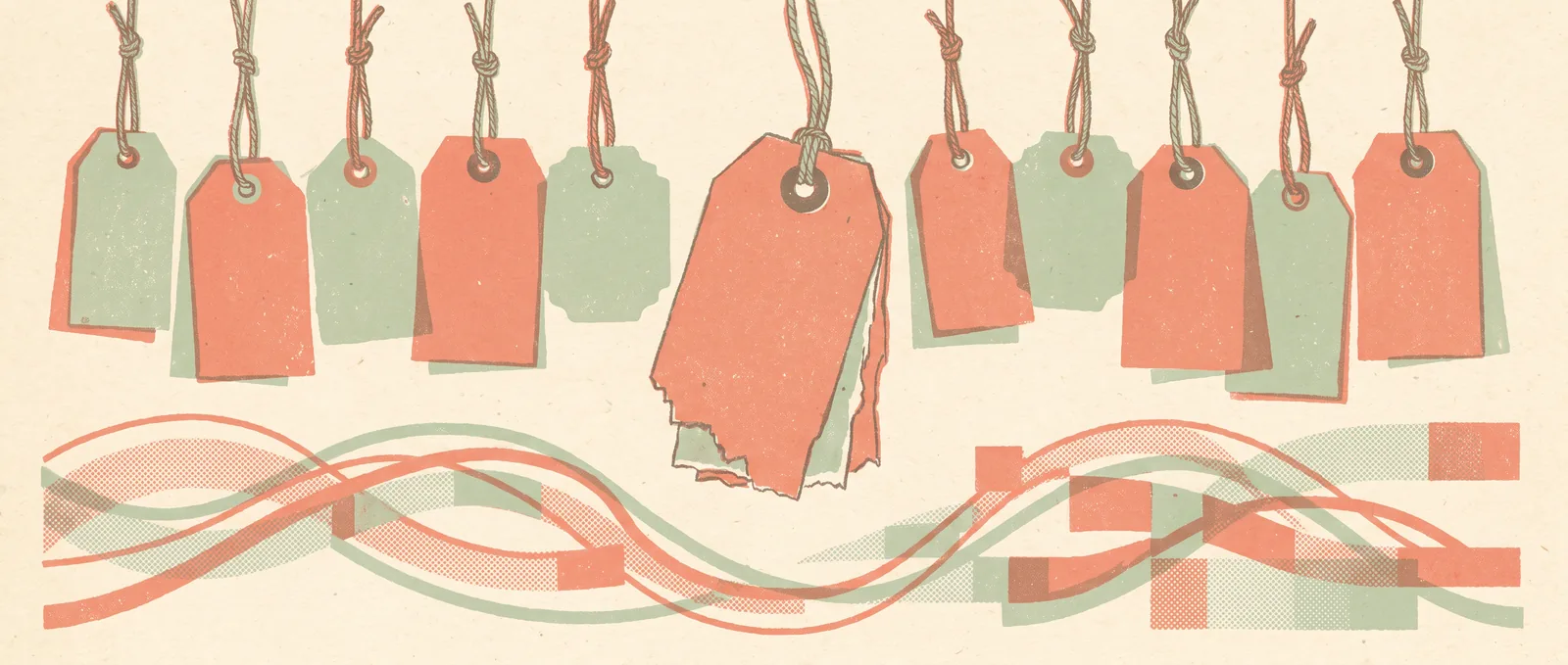A row of hanging market price tags, the largest one cut dramatically shorter than the rest