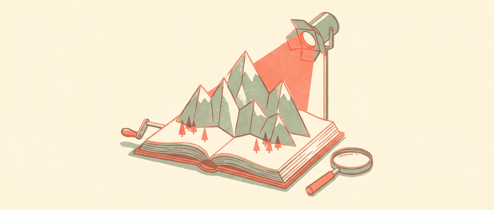 A miniature paper mountain range rising out of an open book on a desk, lit by a single small stage lamp, with a hand crank and magnifying glass beside it