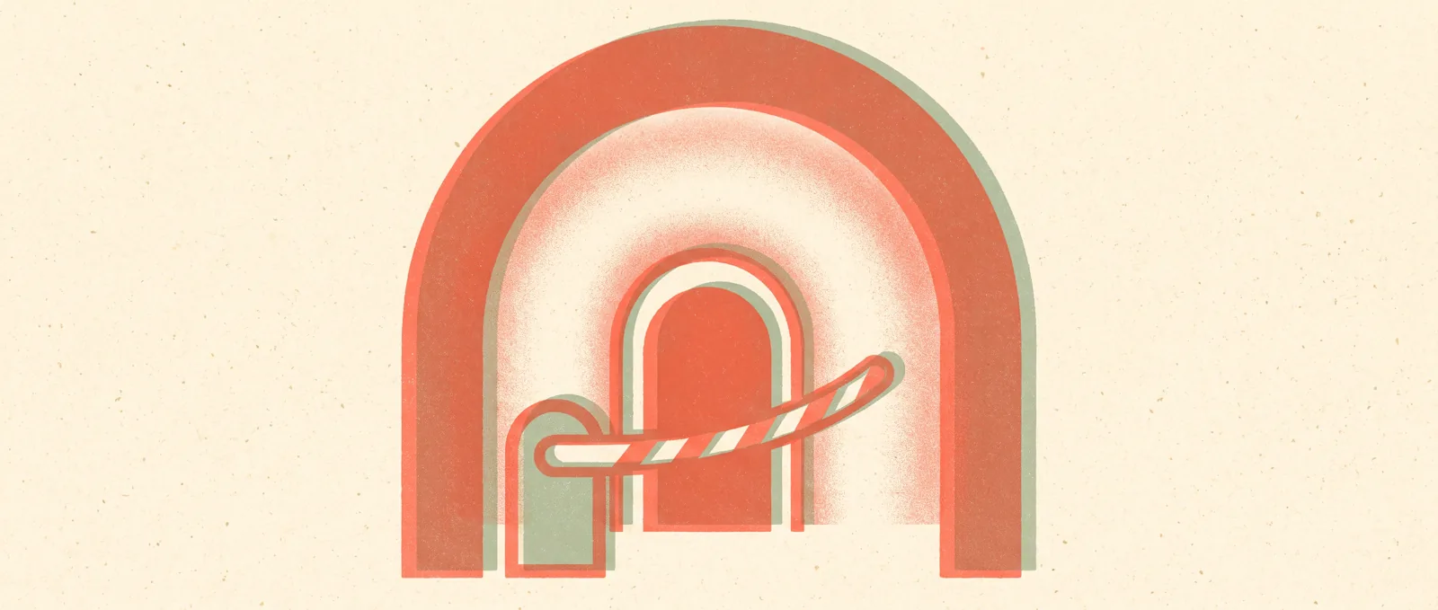 A large arched doorway with a smaller protective doorway nested inside it and a barrier arm lowered across the smaller opening