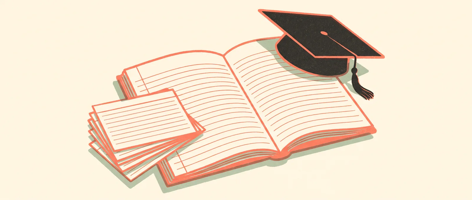 An open notebook with blank ruled pages, a graduation cap resting on one corner and a fan of index cards beside it