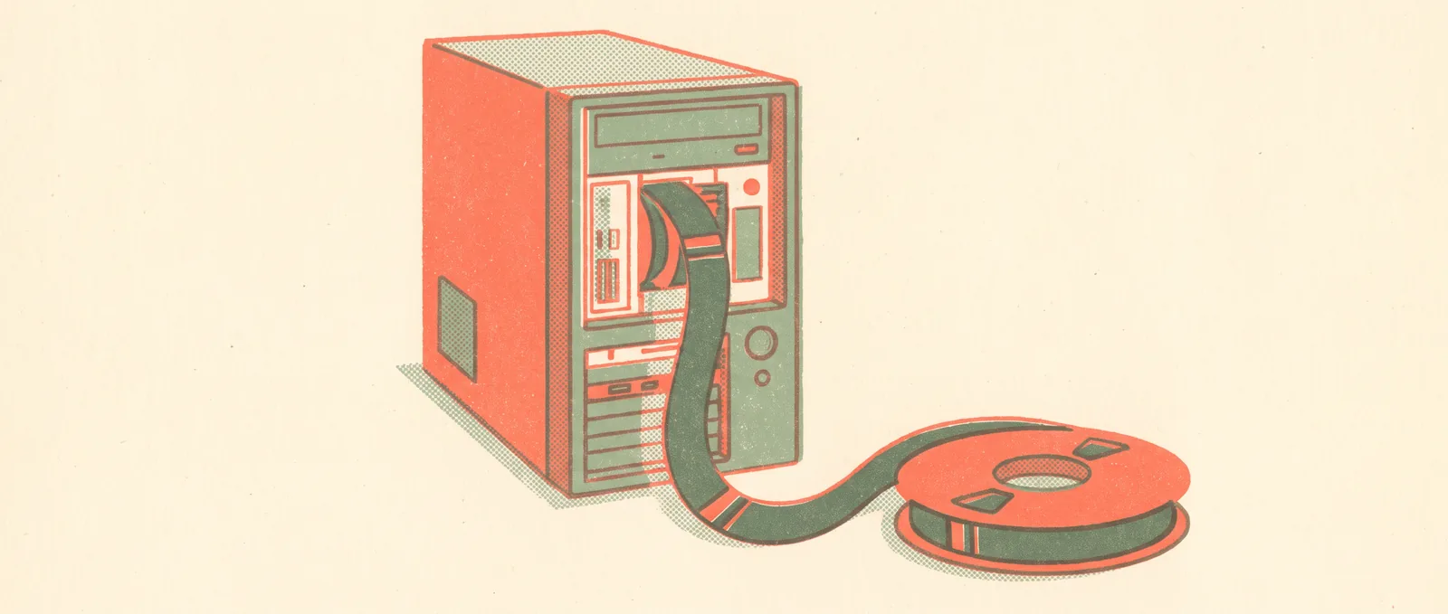 A desktop computer tower with its front open and a wide ribbon of tape feeding into it straight from a spool on the floor